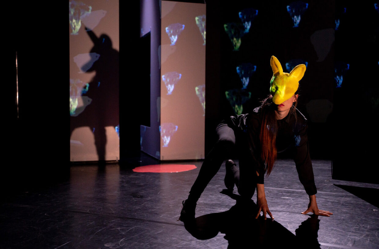 Female actor wearing a fox mask